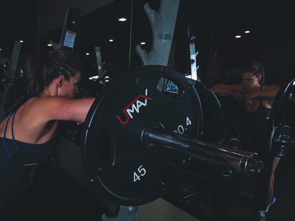 woman training in a weight room