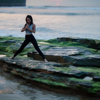 woman stretching on a beach