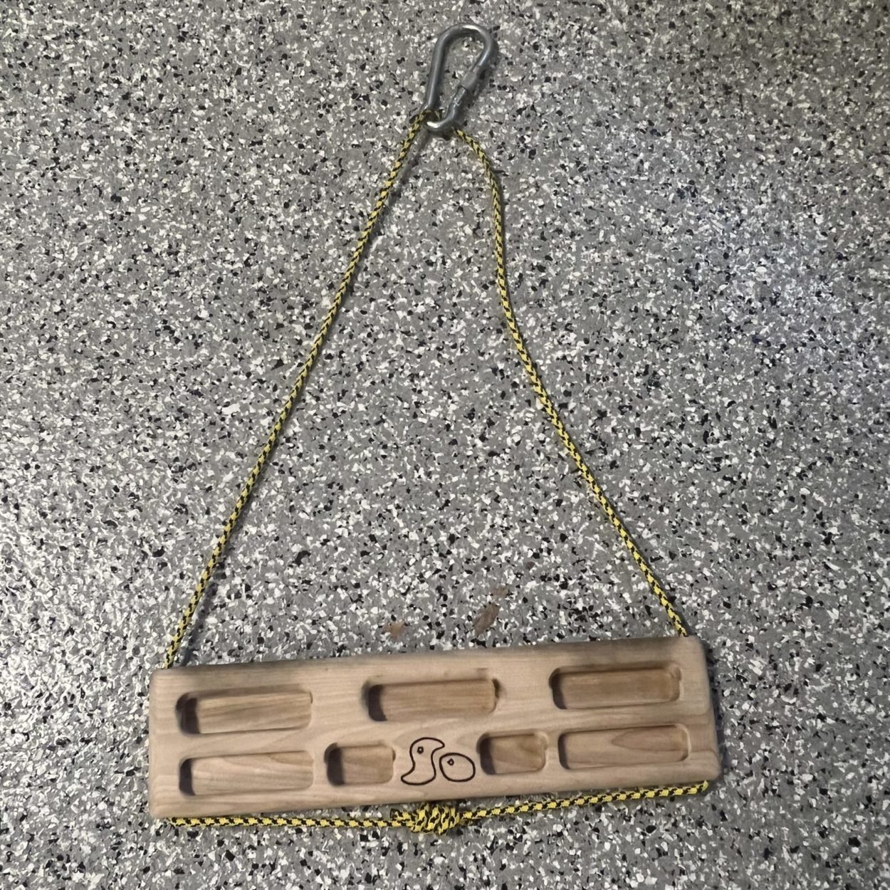 hang board with carabiner and rope