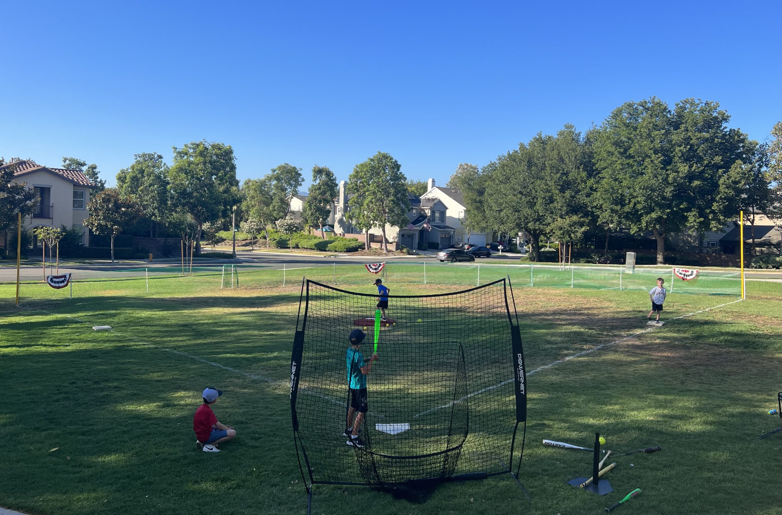 a diy wiffle ball field on a summer day