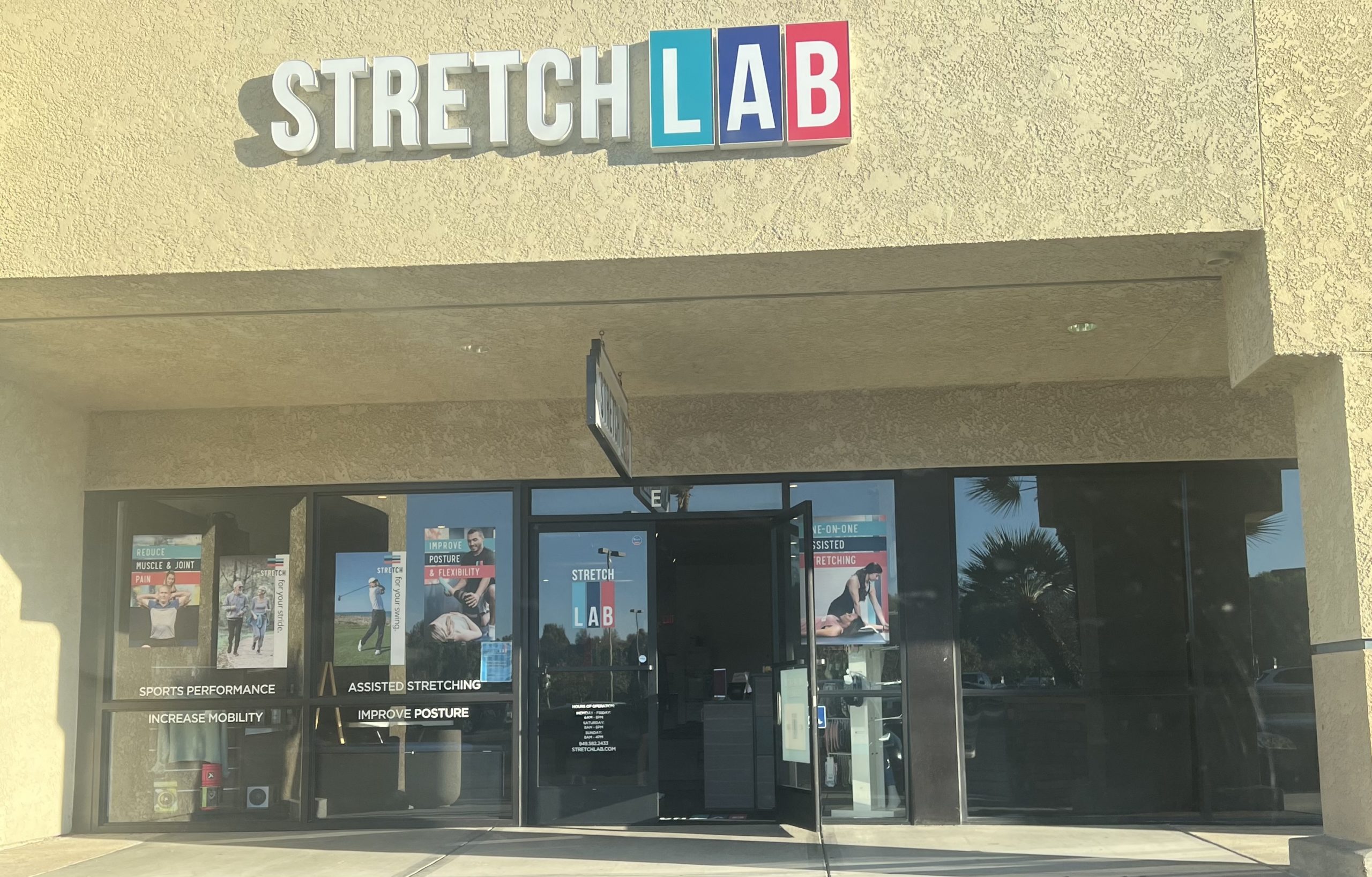 Stretchlab store front for personal trainer stretching