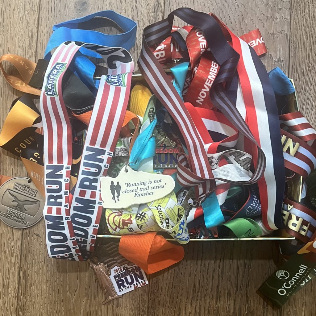 box of race medals on display