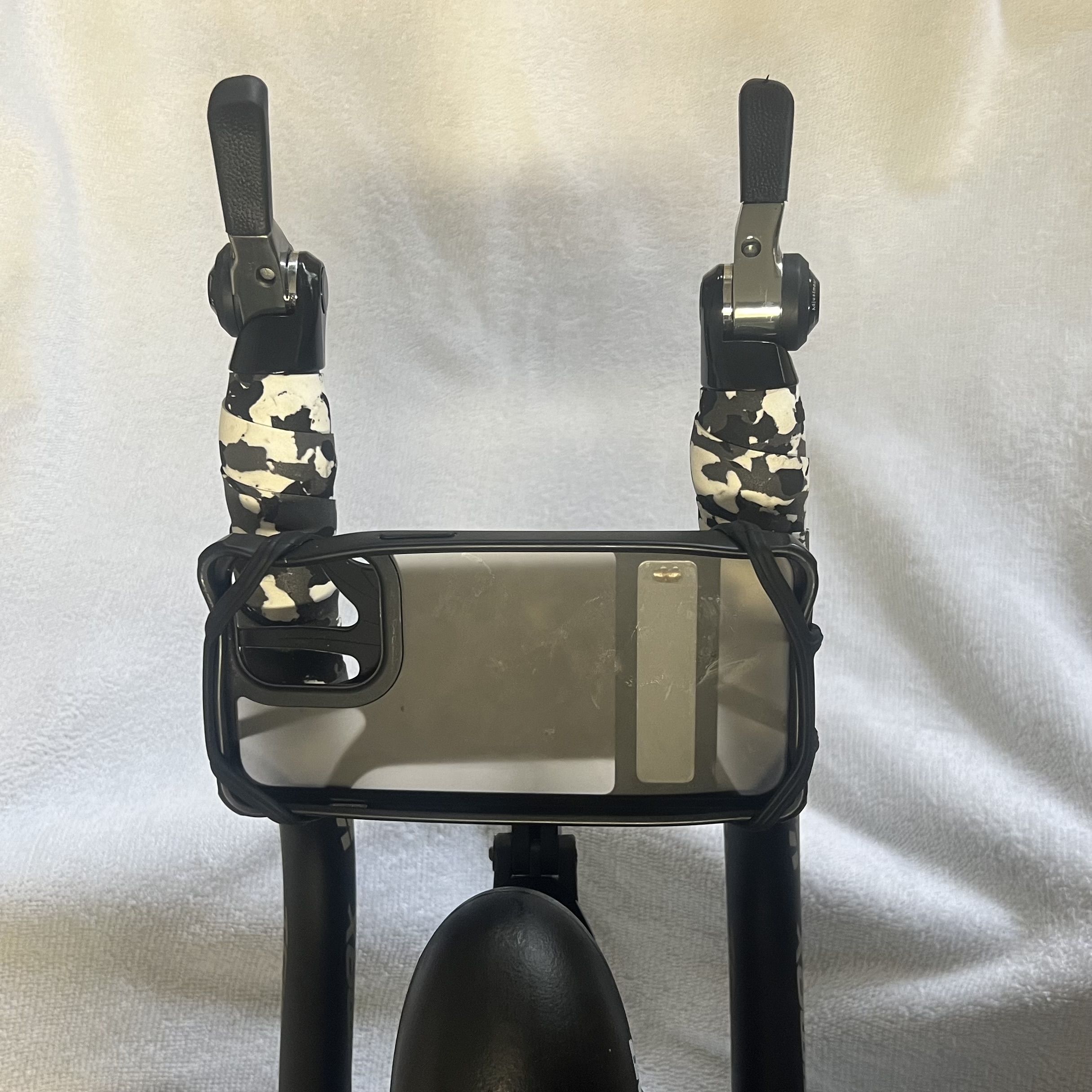 iphone case mounted on bike for zwift